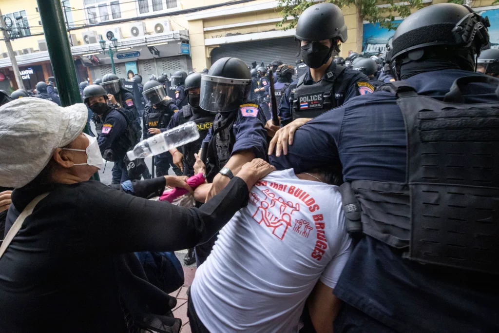 Thai riot police attacking pro-democracy protesters near Democracy Monument during November’s APEC Summit in Bangkok1
